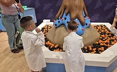 Children playing with volcano game at cookie promotion event