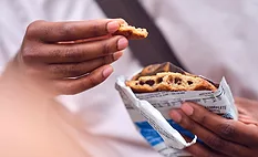 man eating cookie